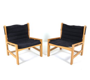 PAIR OF SCANDINAVIAN PINE LOUNGE CHAIRS C. 1970S: Pine frames with black fabric sling seat. Dimensions: H 28" x W 23.75" x D 23.5" x SH 14". Condition: Scuffs and dings to frame. Wear consistent with age and use. PN106