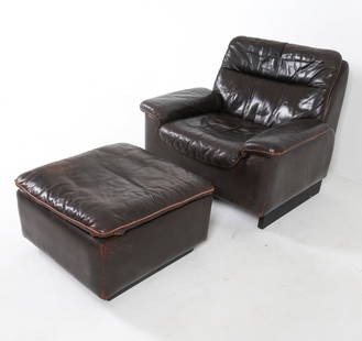 DE SEDE DS 66 LEATHER LOUNGE CHAIR & OTTOMAN: Branded to fabric lining under cushions. Switzerland, circa 1970s. Dimensions: Chair H 33.25" x W 32" x D 33" x SH 17.25". Ottoman H 16" x W 25" x D 25". Condition: Few tears to leather on ottoman. Sc