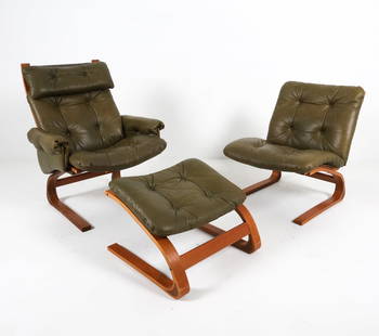 RYKKEN TEAK & LEATHER LOUNGE CHAIRS & OTTOMAN: His & hers with ottoman. Green-tone leather upholstery. Dimensions: (Largest) H 37.75" x W 31" x D 28", SH 19" Condition: Scattered nicks to legs. Light musty scent to leather. presents well overall.