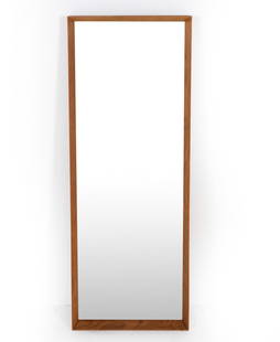 AARHUS DANISH OAK WALL MIRROR C. 1960S: Label to backside. Dimensions: H 46.25" x W 17" Condition: Light dings and scuffs to edges. Slight separation to wood grain on top edge. Wear consistent with age and use.