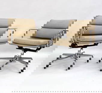 EAMES HERMAN MILLER SOFT PAD MANAGEMENT CHAIRS: Iconic rolling chairs originally designed by Charles & Ray Eames for Herman Miller in the 1950s. Adjustable height, with a swivel. Leather, aluminum frame, steel column. Circa 2007. Tags on underside.