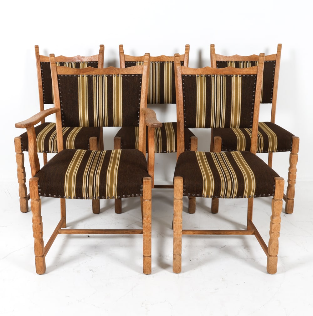 (5) HENNING KJAERNULF STYLE DANISH DINING CHAIRS: Oak frames with wool upholstery. Brass tacks accents. Dimensions: H 37" x W 25" x D 19.25" x SH 17.5". Condition: Few minor scuffs and rubs to wood. Wear consistent with age and use. GCE024