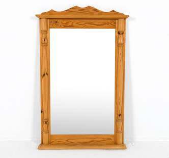DANISH PINE WALL MIRROR C. 1970S: Carved decoration to pine frame. Dimensions: H 39.5" x W 25.25". Condition: Minor scuffs and scratches to wood. Wear consistent with age and use. PER E103