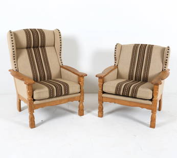 PAIR OF KJAERNULF STYLE DANISH OAK LOUNGE CHAIRS: Oak frames with wool upholstery. Brass tacks accents. Denmark, circa 1970s. Dimensions: H 34" x W 30" x D 30.5" x SH 17". Condition: Wear consistent with age and use. GCE039