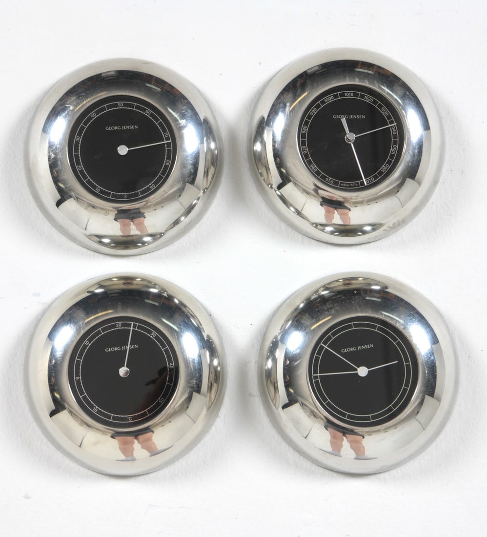 ANDREAS MIKKELSEN FOR GEORG JENSEN WEATHER STATION: Grouping of (4) clocks/meters designed by Andreas Mikkelsen for Georg Jensen. Nickel finish with plastic backing. Dimensions: Dia. 5.5". Condition: Timekeeping and atmospheric readings untested. Minor