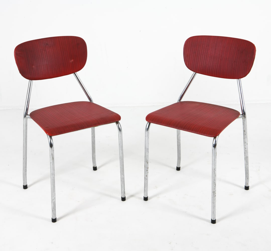 PAIR NORWEGIAN STEEL & VINYL DINING CHAIRS 1970S: Norwegian labels to backside of one chair. Chrome steel frames with red vinyl upholstered seats. Dimensions: H 30" x W 14.25" x D 14.5" x SH 15.5". Condition: Scuffs, scratches, and discolored spots t