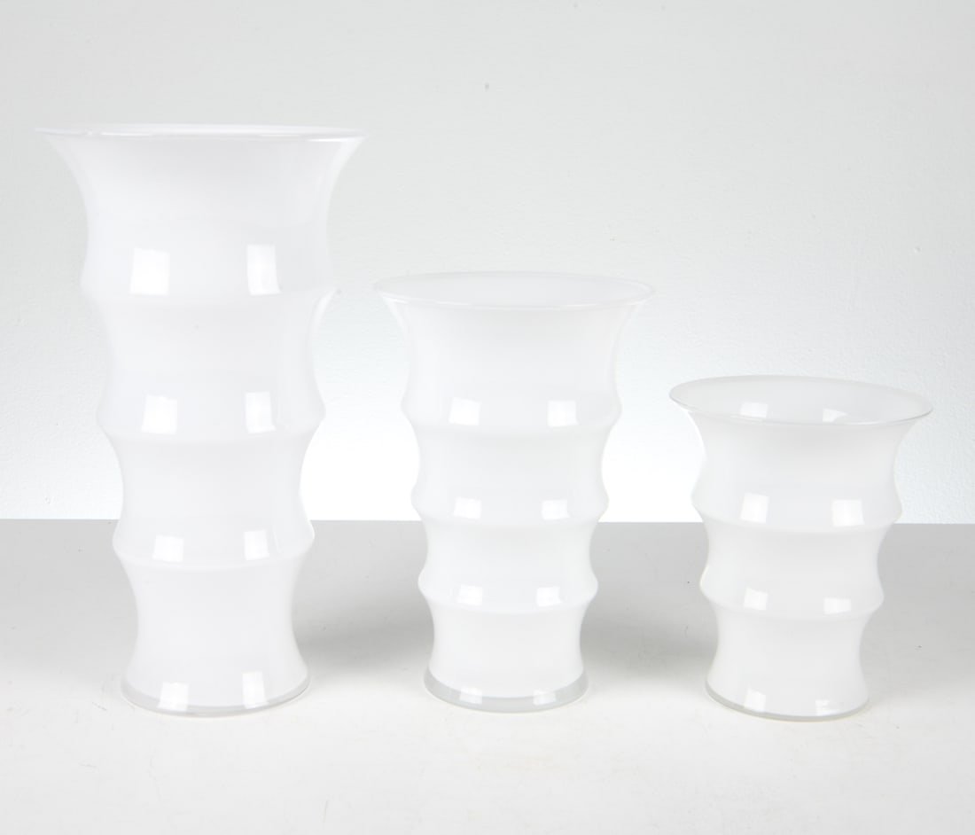 SCANDINAVIAN ART GLASS VASE GROUPING 20TH C.: Grouping of (3) white glass vases. Dimensions: Largest H 12.25" x Dia. 7". Condition: Minor scuffs, good presentation overall.