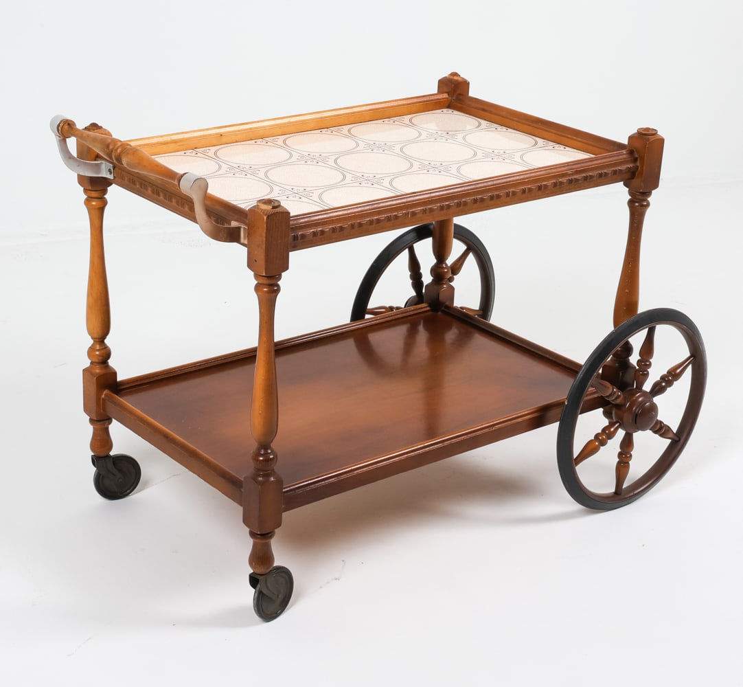 VINTAGE PRL BEECH & CERAMIC BAR CART, C. 1970S: Dimensions: H 24.25" x W 20.25" x D 35". Condition: Minor losses to carved wooden tops on corners. Sun fading and rubs to wood on sides, handle. Wear consistent with age and use.