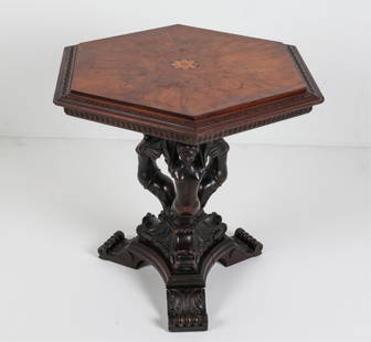 RENAISSANCE STYLE BURL WOOD FIGURAL NUDE TABLE: Circa 2 Burl wood top with floral design to center. Base presents three carved female figures, possibly in stained oak with scrolled feet. Dimensions: H 30.5" x W 30" x D 30" Conditions: rubs and scuf