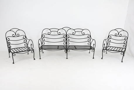 FRENCH WROUGHT IRON PATIO SUITE: Dimensions: (sofa) H 35" x W 64" x D 28" S.H. 12.5". Chairs W 24". Condition: Showing signs of wear including losses to paint and light oxidation consistent with outdoor exposure.