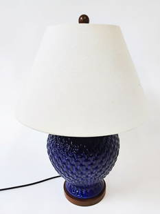 CONTEMPORARY CERAMIC TABLE LAMP: Textured body in cobalt blue. Dimensions: (w/shade) H 26" x Dia. 18" Condition: Shade with minor soiling spots to shade. Wear consistent with age and use. Untested.