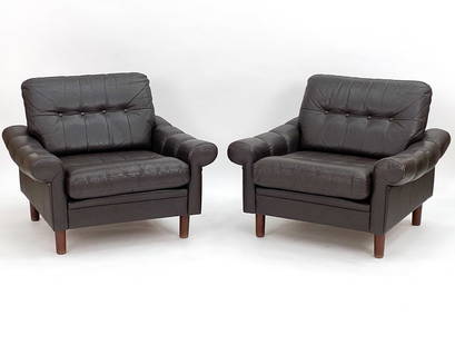 PAIR OF DANISH TUFTED LEATHER LOUNGE CHAIRS: Dark brown leather upholsterd chairs with tufted buttons. Apparently unmarked. Dimensions: H 26" x W 35" x D 30" x SH 16" Condition: Light wear consistent with age and use. Minor scuff to armrest of o