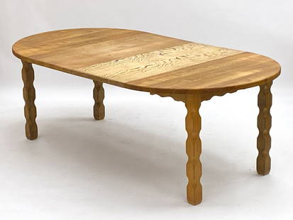 KJAERNULF DANISH OAK EXTENDING DINING TABLE: (2) Leaves included. Denmark, circa 1970s. Dimensions: H 29.75" x Dia. 47". Leaves W 19.5". Condition: Wear consistent with age and use.