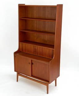 JOHANNES SORTH NEXO DANISH TEAK BOOKCASE: Secretary desk & bookshelf with carved recessed handles. Includes three small drawers behind the tambour, sliding doors and shelves. Marked 334 36 on the back. Dimensions: H 71.75" x W 39.5" x D 16.75
