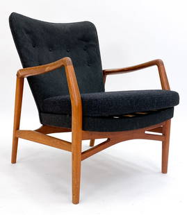 KURT OLSEN MODEL 215 DANISH TEAK LOUNGE CHAIR: For Slagelse. Teak frame with wool upholstered seat. Denmark, circa 1950s. Dimensions: H 33.25" x W 26.5" x D 27" x SH 17". Condition: Few scuffs and rubs to wood. Some wear to wool.