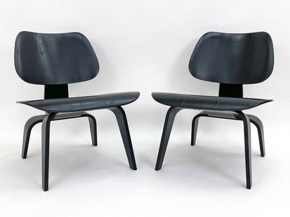 PAIR OF CHARLES EAMES VITRA LCW LOUNGE CHAIRS: Originally designed by Charles and Ray Eames in the 1940s. Known as the 'LCW', or Lounge Chair with Wood base. Tagged underneath. 20th century. Dimensions: H 26.5" x W 22.5" x D 22" x SH 15.25". Condi
