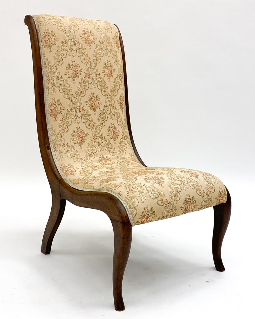 SCANDINAVIAN SLIPPER LOUNGE CHAIR: With floral fabric and beech frame. Circa early 20th century. Dimensions: H 35.5" x W 17" x D 27" x SH 14". Condition: Some dents and nicks in the wood, wear consistent with age and use.