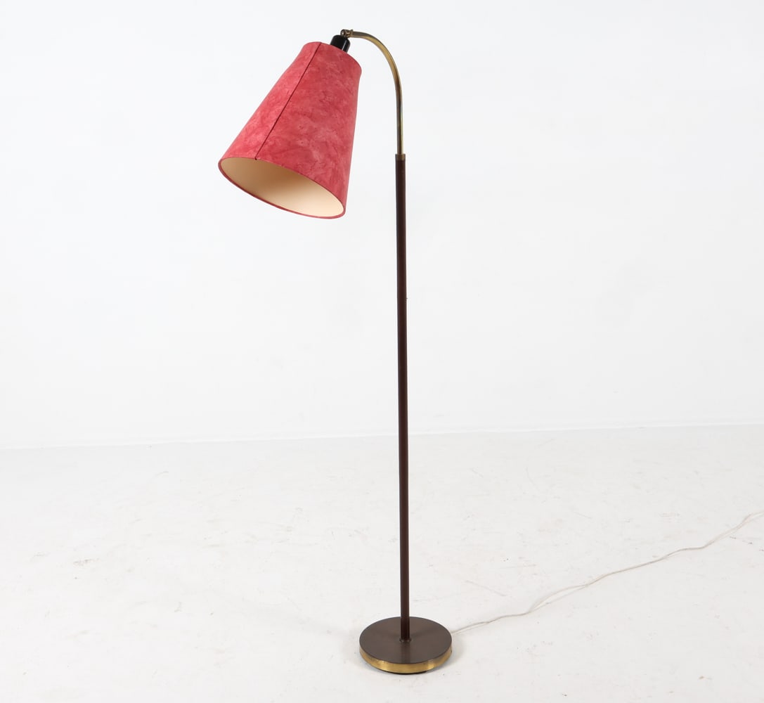 MID-CENTURY DANISH STITCHED LEATHER FLOOR LAMP: Circa 1950s. dimensions: H 54" x Dia 8.75" x D 17" Condition: Tears to leather wrapping. Tarnishing to brass. Loss to shade hardware. Slight scratches and indentation to metal base. Cut wire. Untested