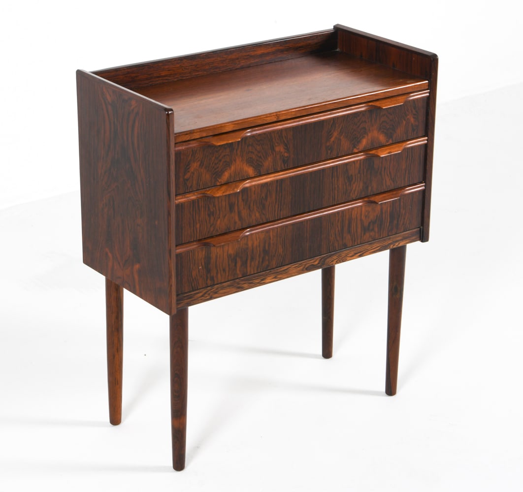 MID-CENTURY DANISH ROSEWOOD NIGHTSTAND CHEST: Dimensions: H 27.5" x W 23.5" x D 11.25" Condition: Minor water marks and surface scuffs. Slight wobble to base. Wear consistent with age and use.
