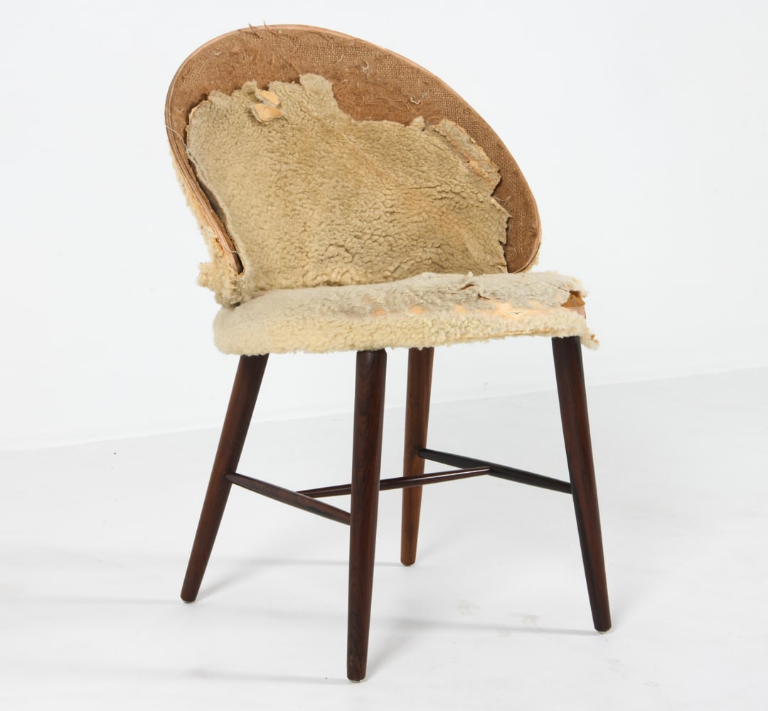 FRODE HOLM DANISH ROSEWOOD SLIPPER VANITY CHAIR: Rosewood side chair with wool upholstery. Denmark, circa 1950s. Dimensions: H 29.5" x W 19" x D 21.5" x SH 16.5". Condition: Great candidate for reupholstering. Wool is mostly detached. Other signs of