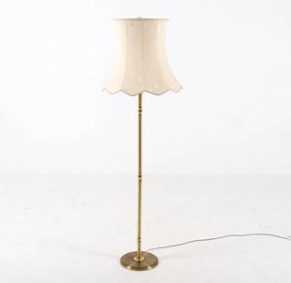 MID-CENTURY SCANDINAVIAN BRASS FLOOR LAMP C. 1960S: Brass-tone metal post with bell shaped shade. Dimensions: (with shade) 61" x Dia 19" Condition: Scattered marks and scuffs to center post. Slight indentations to base. Cut wire, Untested. Wear consist