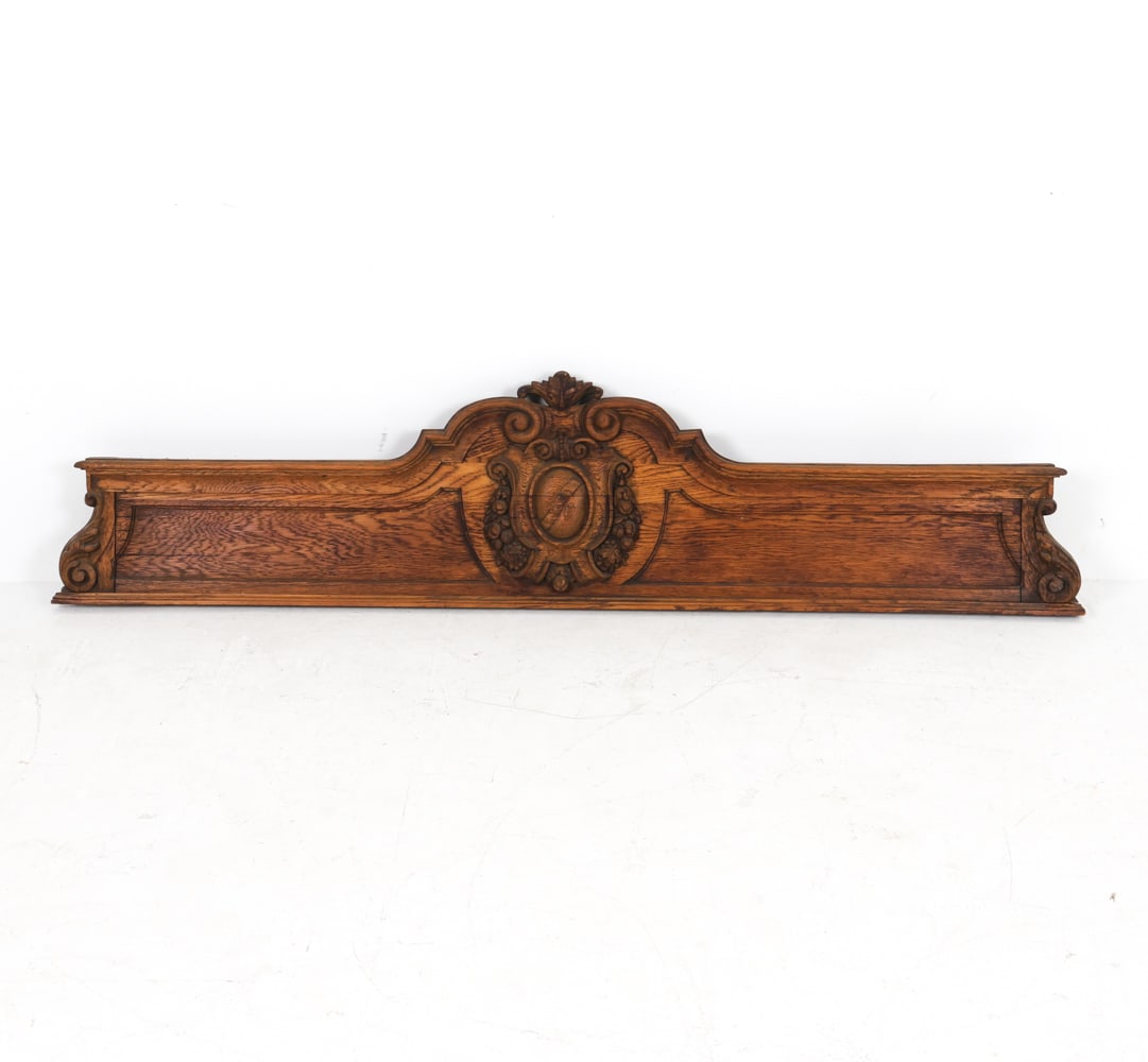 CARVED OAK ARCHITECTURAL WALL DECORATION: Most likely from a piece of furniture. Dimensions: H 17.5" x W 77" x D 2". Condition: Few minor dings and chips, some surface soiling. Wear consistent with age and use.