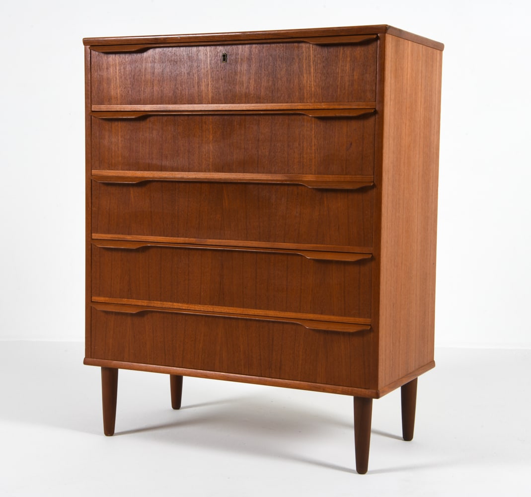 MID-CENTURY DANISH TEAK CHEST OF DRAWERS C. 1960S: Includes (2) keys. Dimensions: H 40.5" x W 32" x D 17.25" Condition: Nicks and dings to surface and outer edges. Wear consistent with age and use. CLA005