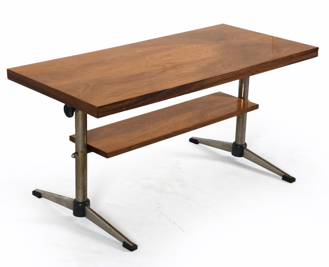 MID-CENTURY POLISH TEAK & CHROME DESK C. 1970S: With adjustable height. Dimensions Lowest H: 22" x W 44" x D 20.5" Condition: Marks, scuffs and oxidation to steel legs and feet. Light surface scratches. Wear consistent with age and use.