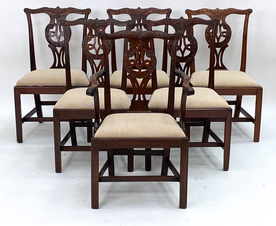 (6) CHIPPENDALE STYLE HAND-CARVED MAHOGANY CHAIRS: 5 side chairs, 1 armchair. Dimensions: H 37" x W 22" x D 19" x SH 18.5" Condition: Dings and other imperfections. Wear consistent with age and use.