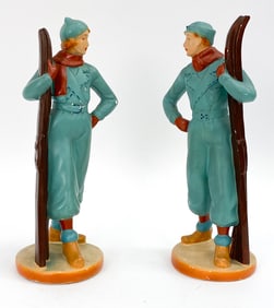 PAIR OF AUSTRIAN CERAMIC SKIING SCULPTURES