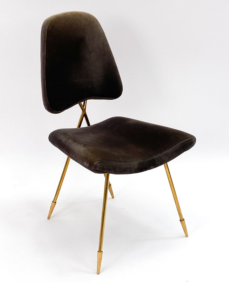 JONATHAN ADLER MAXIME SIDE CHAIR: Features a sculptural brass frame with a charcoal colored velvet upholstery and minimalist design. Tag on underside. Dimensions: H 31" x W 19.5" x D 20" x SH 18" Condition: Couple spots of tearing and
