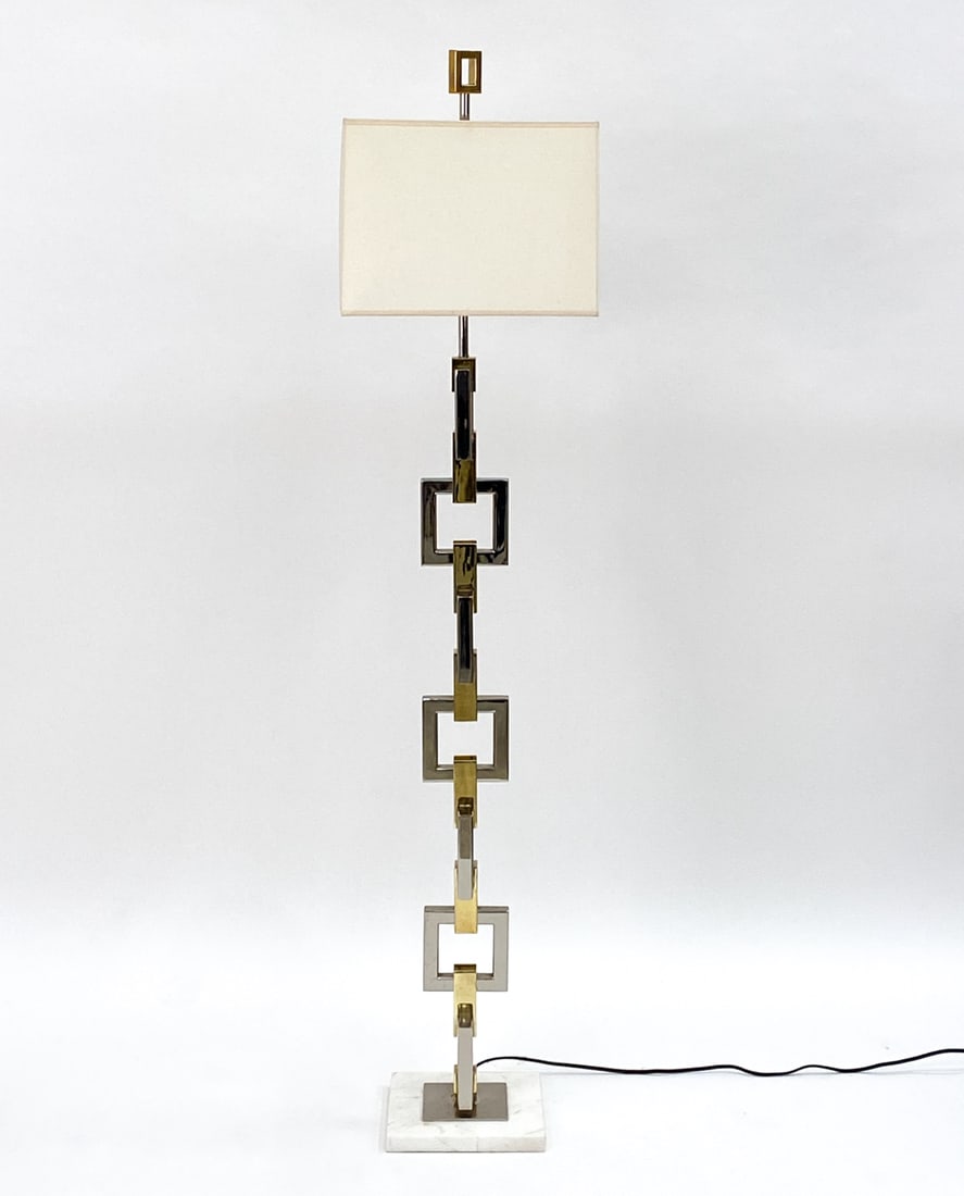 JONATHAN ADLER "NIXON" FLOOR LAMP: Brass and chrome with an alternating square design and a white marble base. With Jonathan Adler label on underside. Dimensions: (To finial) H 68" x W 15" x D 15" Condition: Untested, light surface scr