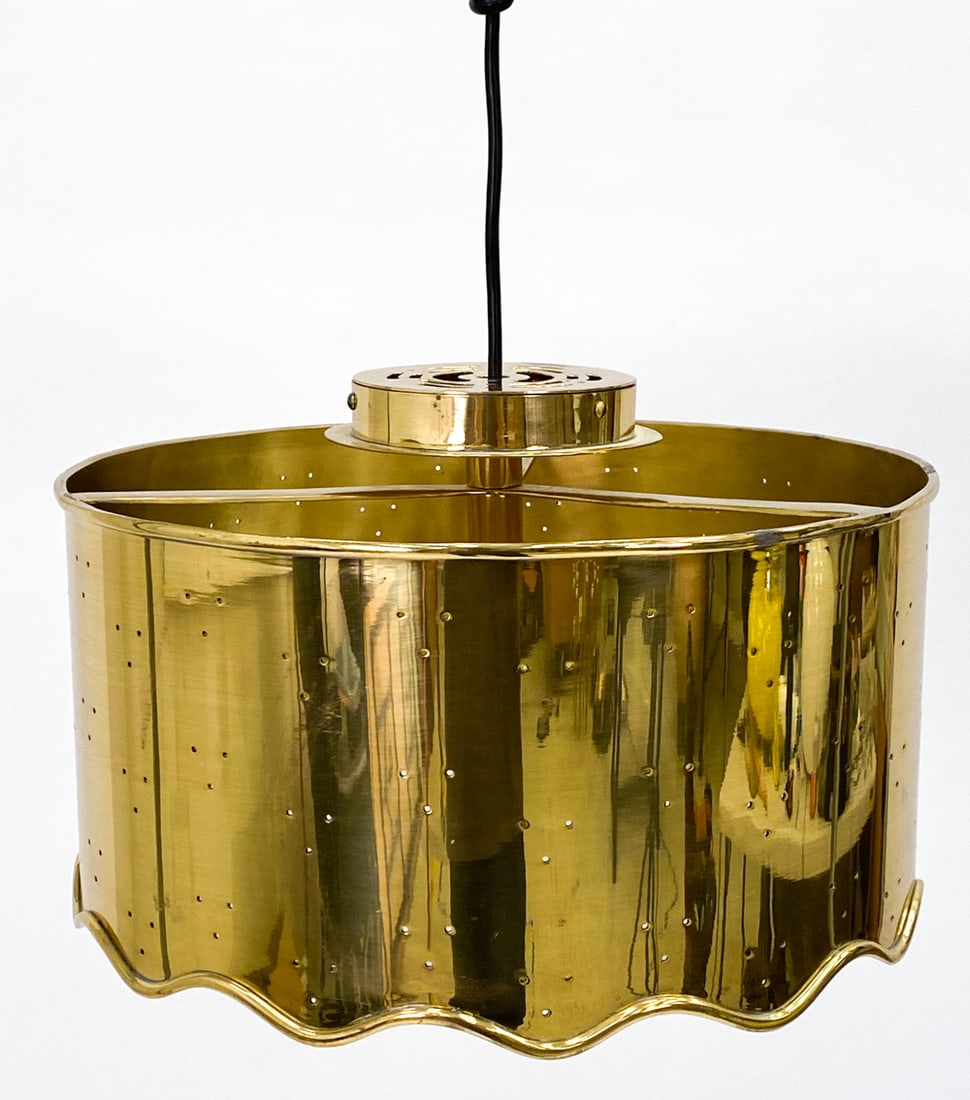 ATTR. JONATHAN ADLER BRASS PENDANT LIGHT: Brass pendant light with cut out holes to create a unique light pattern. Apparently unsigned. Includes hardware for mounting. Dimensions: H 9.5" x Dia 15.25" Condition: Untested, wires cut. Light surf