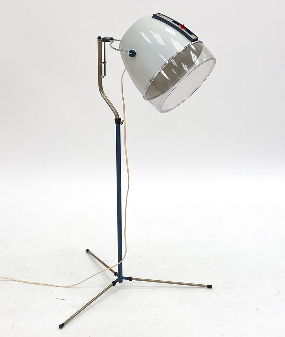 VINTAGE PHILIPS STANDING HAIR DRYER C. 1960S: Type 4120. Standing hair dryer with adjustable height. Made in Holland. Dimensions: H 47" x Dia. 27". Condition: Wiring untested. Some slight discoloration to plastic. Wear consistent with age and use