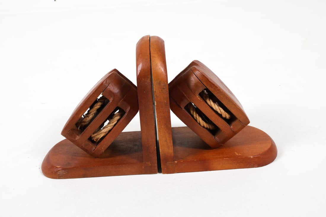 SCANDINAVIAN TEAK NAUTICAL PULLEY BOOKENDS 1960S: Dimensions: H 6.75" x W 4"x D 6.25" Condition: Scattered rubbing and nicks to teak. Wear consistent with age and use. PN180