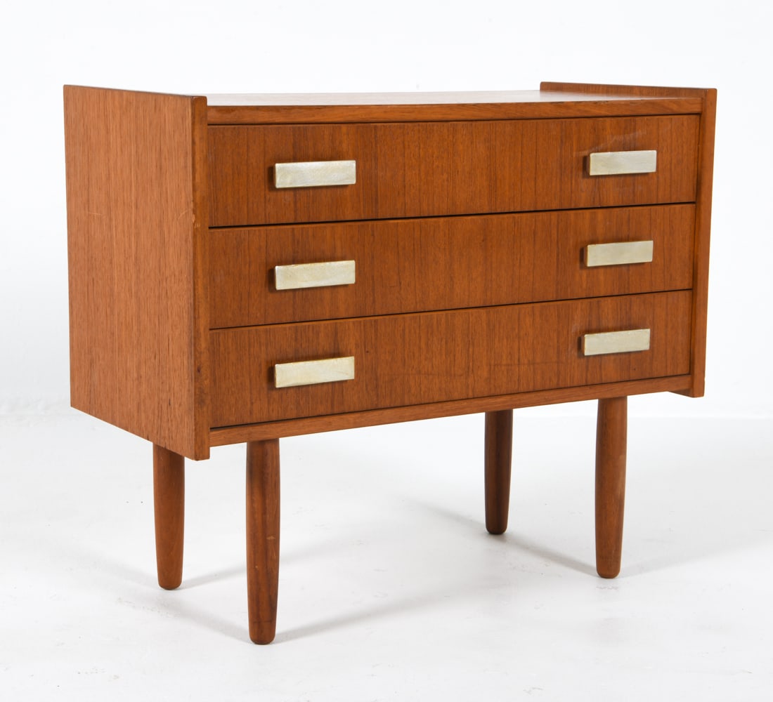SCANDINAVIAN TEAK CHEST OF DRAWERS C. 1960S: Dimensions: H 22' x W 25.5" x D 12" Condition: Light blemishes and surface scratches. Dings and rubbing to edges. Presents well overall. DDE C
