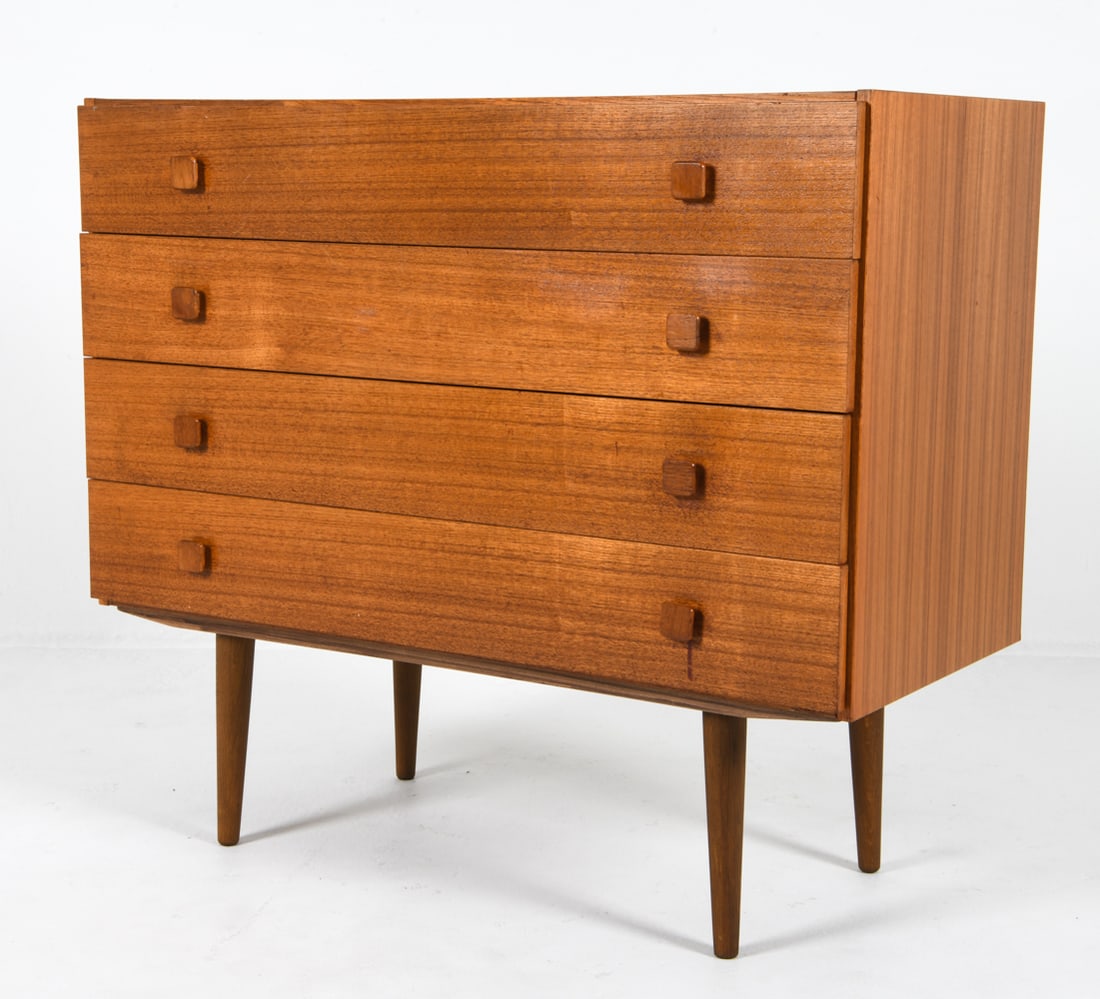 MID-CENTURY DANISH TEAK CHEST OF DRAWERS C. 1960S: With square form drawer pulls. Dimensions: H 35" x W 39.25" x D 18" Condition: Sun fading to surface. Scattered marks and nicks to edges and drawer faces. Wear consistent with age and use. DDE C