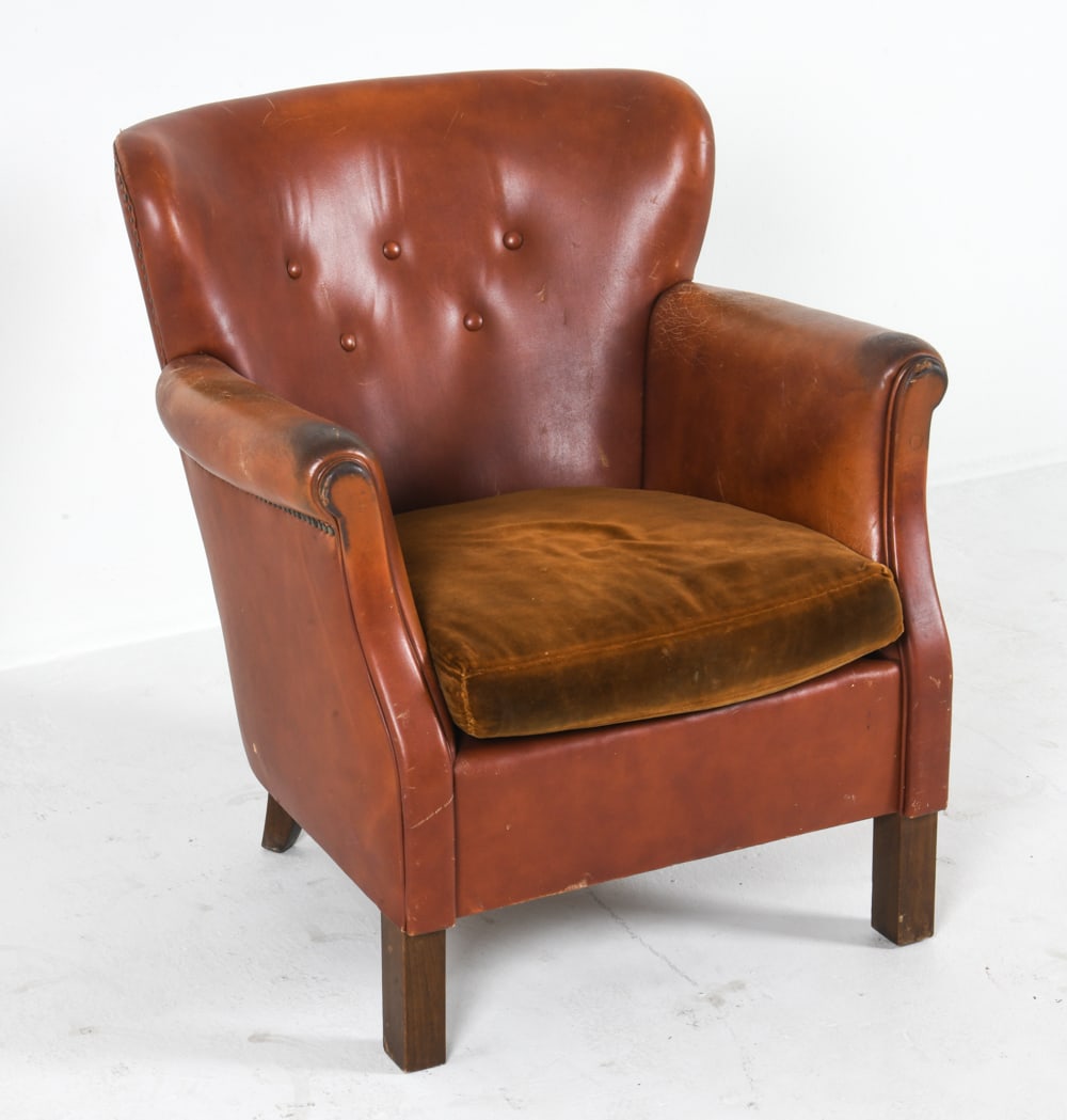 DANISH MID-CENTURY LEATHER & MOHAIR CLUB CHAIR: Circa 1960s. Cognac-tone leather upholstery with tack edges. Brown-tone mohair seat cushion. Dimensions: H 29" x W 26.25" x D 24", SH 15" Condition: Moderate sun fading, discoloration and creases to l