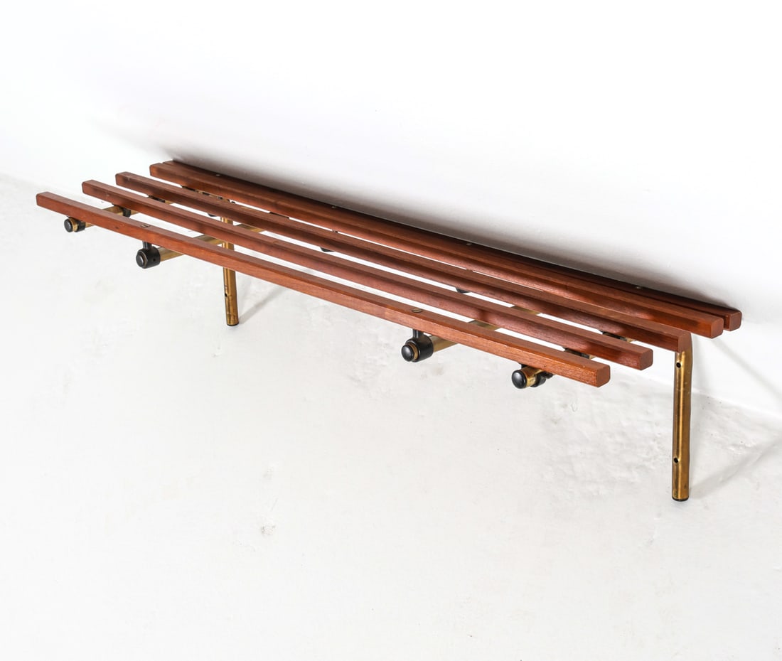 SCANDINAVIAN MID-CENTURY TEAK COAT RACK SHELF: Circa 1960s. Teak shelf with brass-tone metal posts and coat hooks. Dimensions: H 10" x W 39.5" x D 11" Condition: Tarnishing and scuffs to posts. Nicks and dings to teak shelf. Wear consistent with a