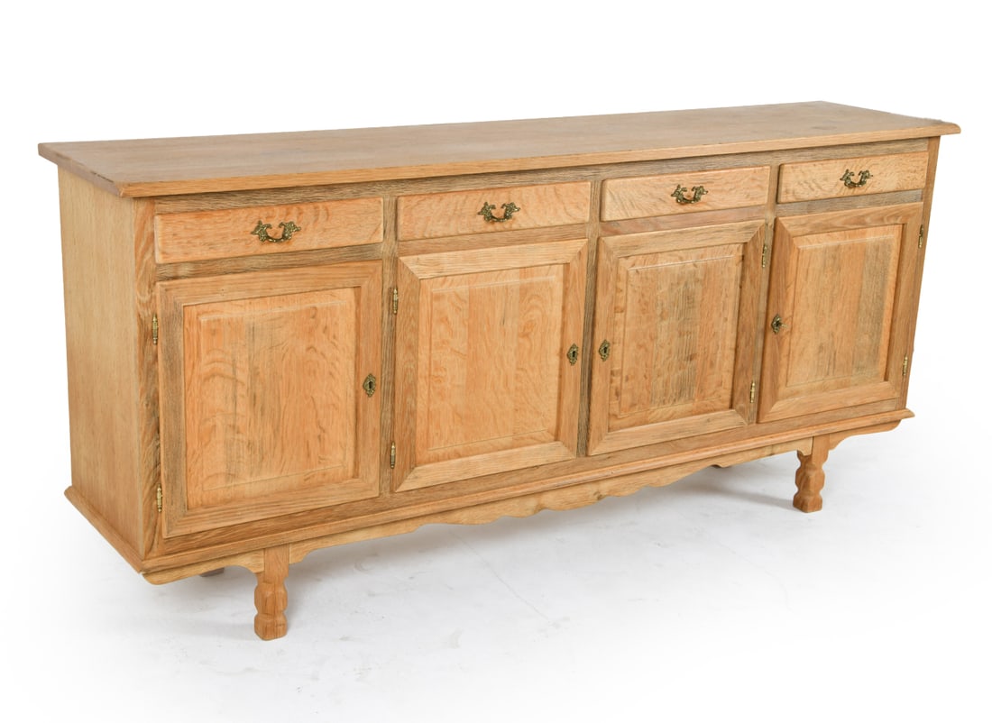 KJAERNULF STYLE DANISH OAK SIDEBOARD C. 1970S: Includes (1) key. Brass hardware. Adjustable shelves. HM Mobler stamped to backside. Dimensions: H 37" x W 80" x D 18" Condition: Rubbing and light surface marks. Presents well overall.