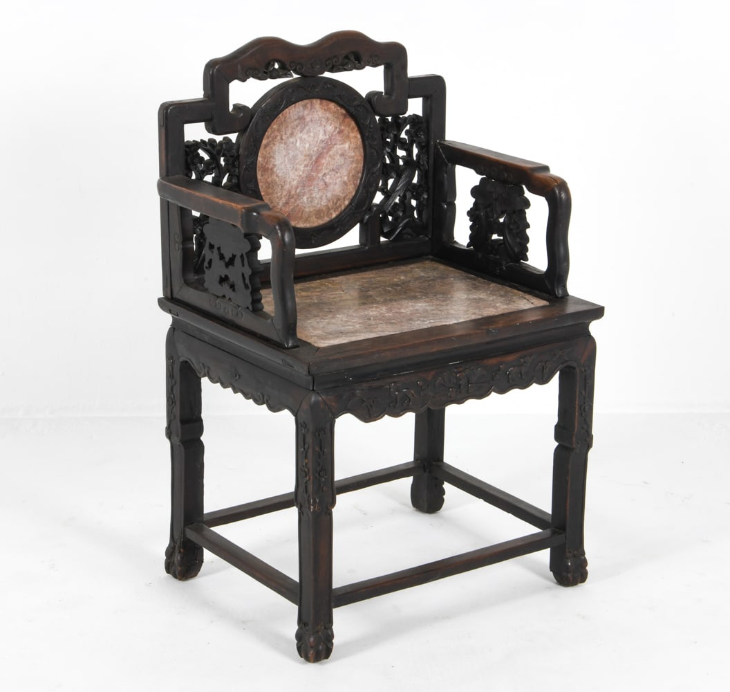 19TH C. CHINESE CARVED DREAMSTONE CHAIR: Carved detailing to backrest and armrests. With carved legs and scalloped apron. Inlaid marble seat and backrest. Dimensions: H 38" x W 25" x D 1" Condition: Joint separation to armrests. Gaps in wood