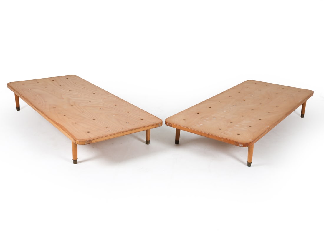 PAIR OF DANISH TWIN DAYBEDS C. 1960S: Pair of daybed frames with brass capped feet. Dimensions: H 11" x W 31.75" x D 73.5". Condition: Scuffs and scratches, mostly to edges and corners. Wear consistent with age and use.