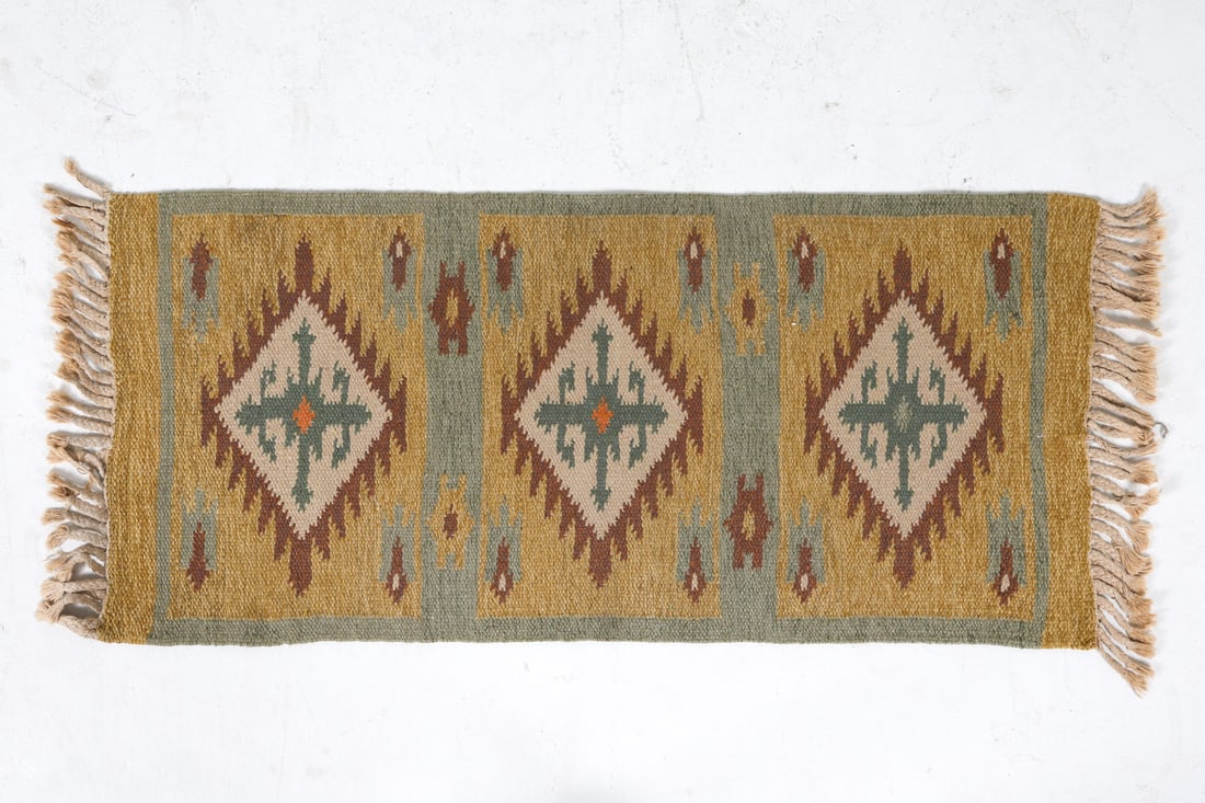 MID-CENTURY SCANDINAVIAN KILIM WOOL RUG C. 1970S: Dimensions: L 58" x W 24". Condition: Slight sun fading. Wear consistent with age and use.