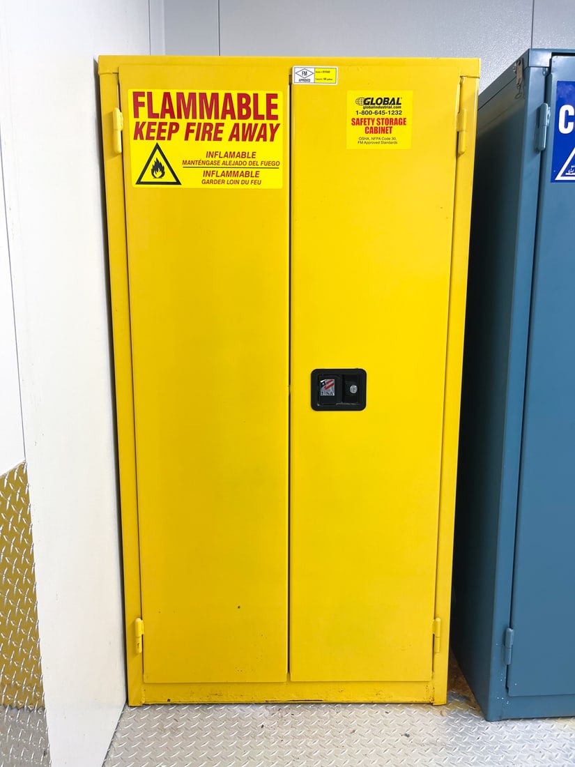 FLAMMABLE SAFETY STORAGE CABINET: 4 adjustable shelves, meant to contain flammable material. Model number BM60, capacity 60 gallons, FM approved. Dimensions: H 65.5" x W 35.5" x D 35" Condition: Lacking key. Light marks and scratches 