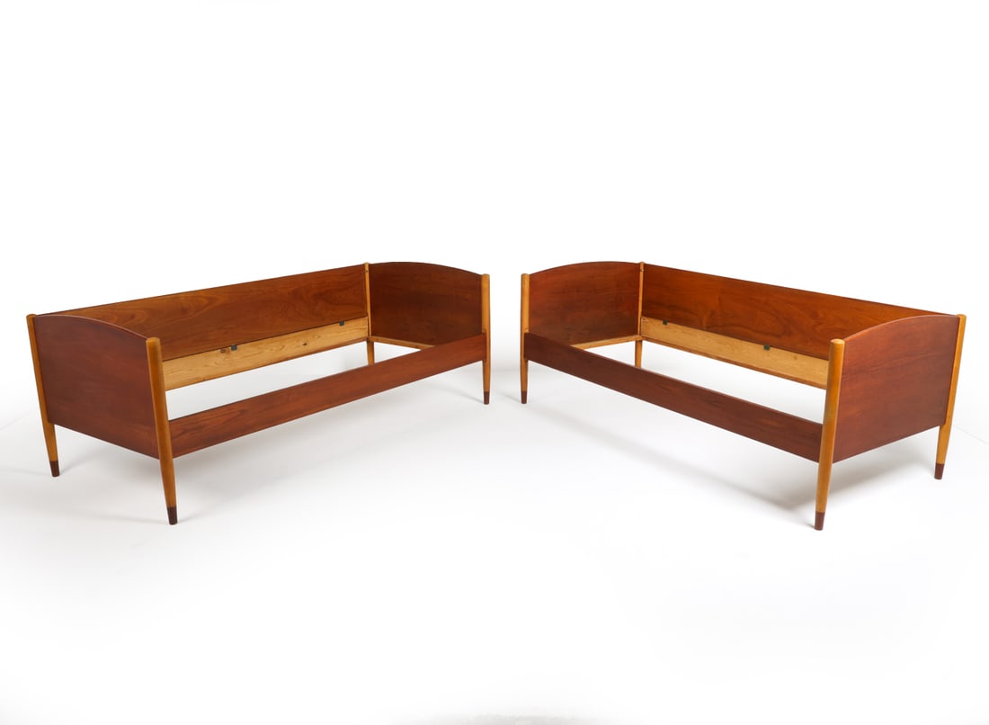 PAIR ATTR. BORGE MOGENSEN TEAK DAYBEDS C. 1960S: Pair teak day beds. Side rail is able to be removed or placed on either side of each bed. Denmark, circa 1960s. Dimensions: H 28.5" x W 36.25" x D 77.5". Condition: Minor scuffs and dings. Wear consis