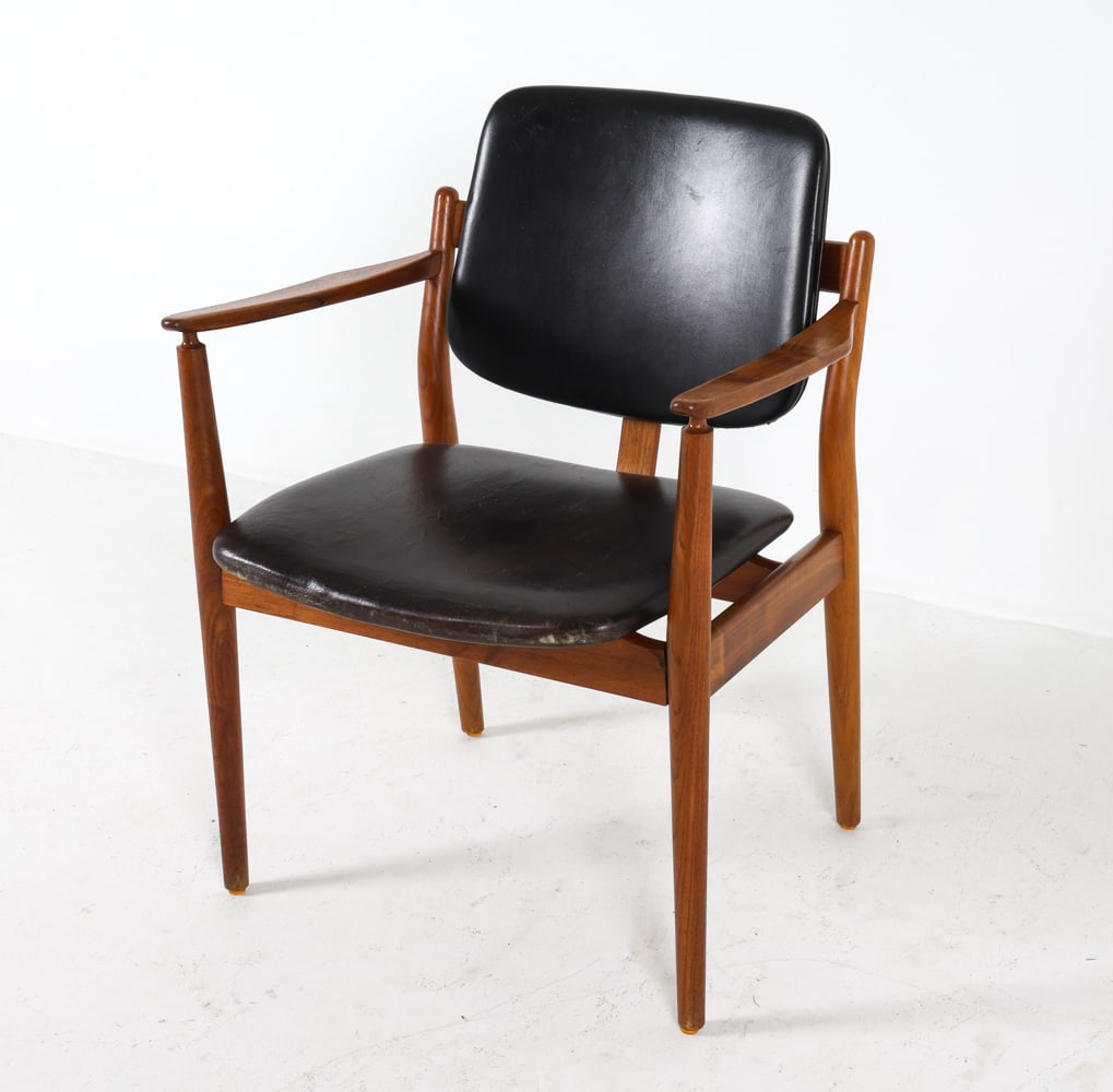 ARNE VODDER TEAK & LEATHER ARMCHAIR C. 1960S: Teak frame with black leather upholstery. Denmark, circa 1960s. Dimensions: H 31.5" x W 24.5" x D 19.5" x SH 17.75". Condition: Few minor scuffs to wood and leather. Wear consistent with age and use.