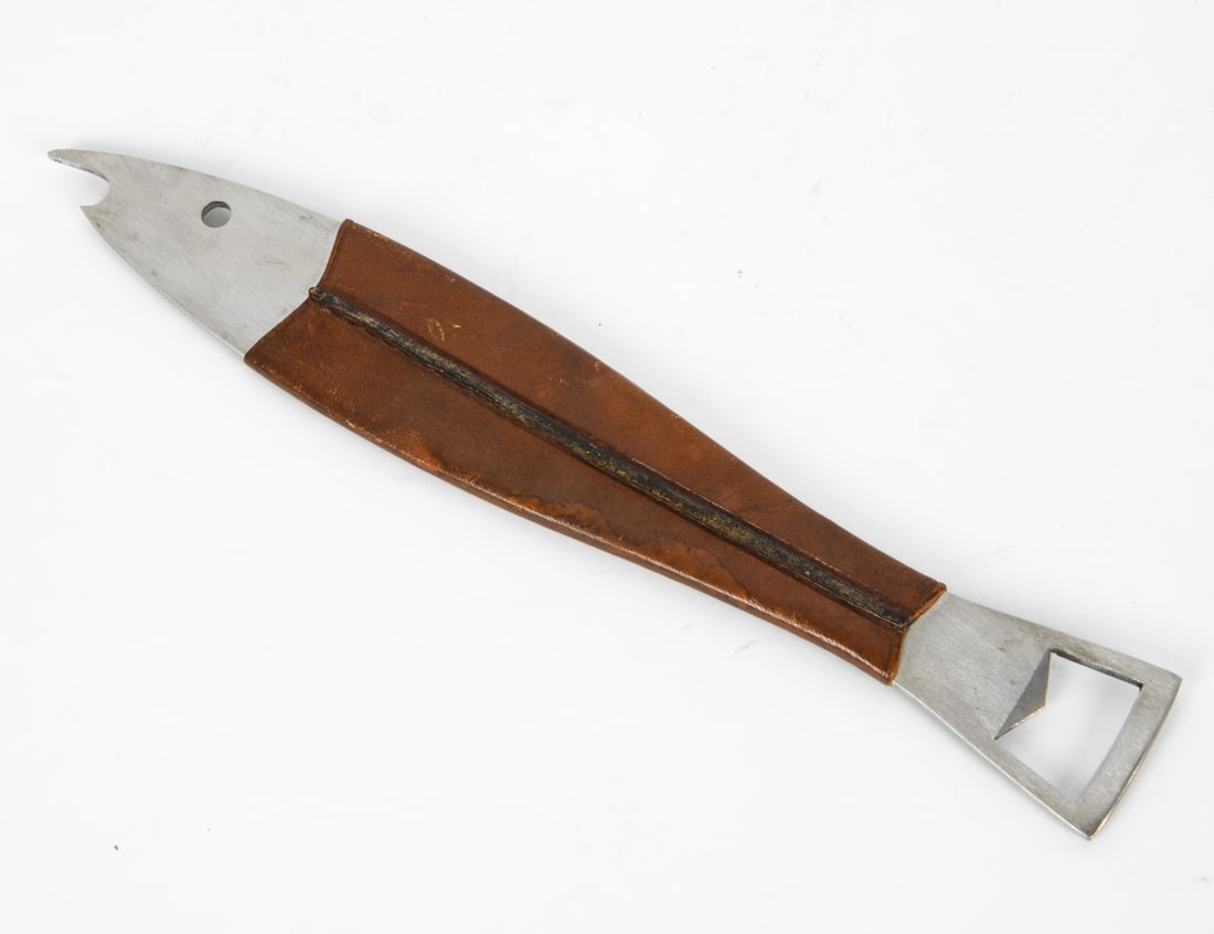 CARL AUBOCK ARTHUR SALM BOTTLE OPENER: Leather wrapped steel "Neptune" bottle opener in the form of a fish. Designed by Werkstatte Carl Aubock for Arthur Salm, circa 1960s. Marked on tail end. Dimensions: L 9.5" x W 1.5" Condition: Light s