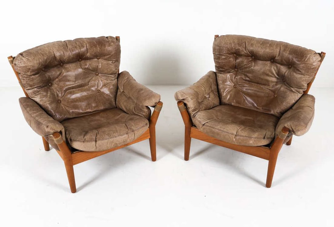 PAIR OF LOUNGE CHAIRS BY JOHN MORTENSEN: This pair of lounge chairs, known as Model 4251, was designed and produced in the early 1970's by John Mortensen for Magnus Olesen. This set is as comfortable as they are stylish, combining the modern