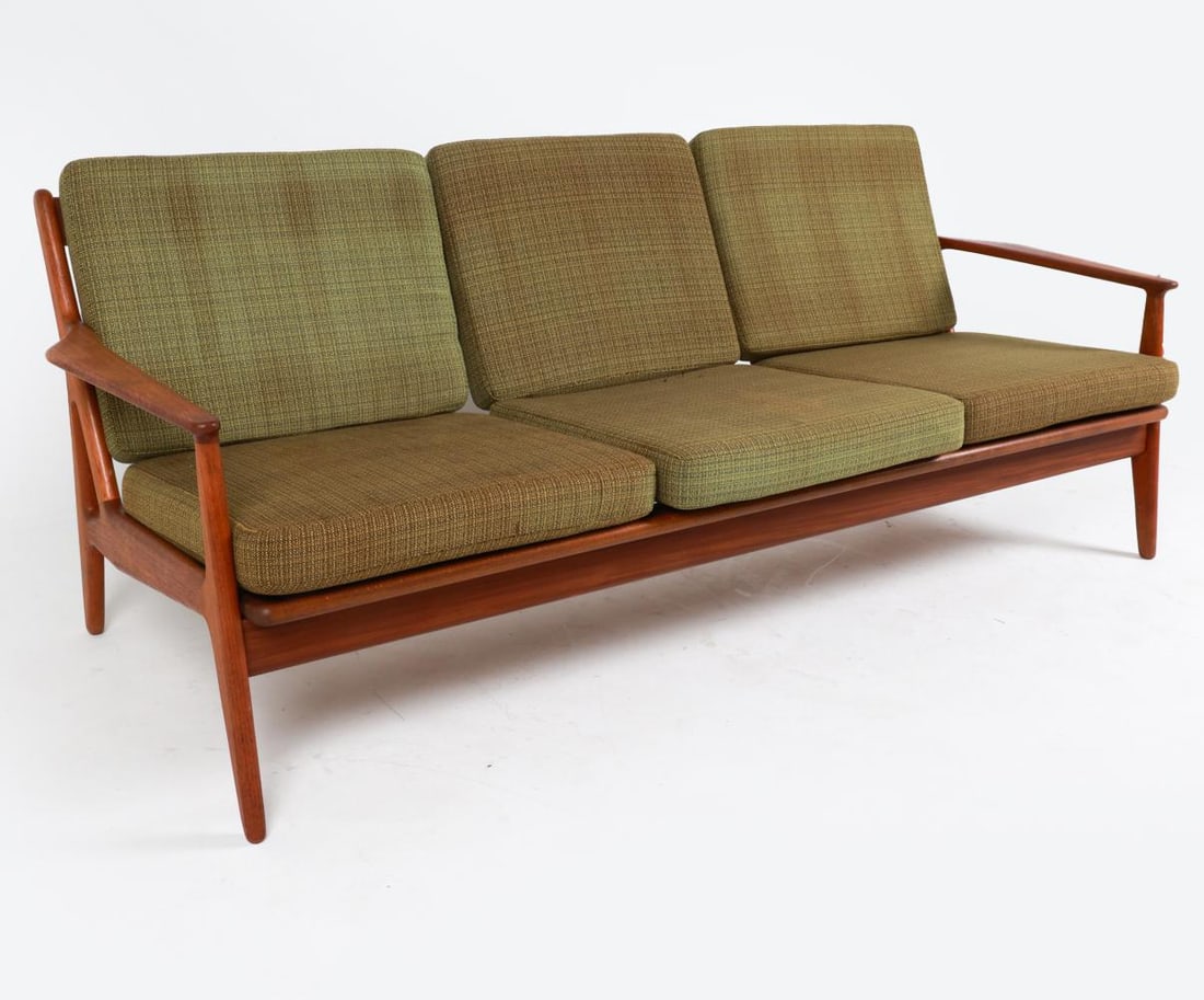 ARNE VODDER MID-CENTURY DANISH TEAK SOFA: This elegant teak sofa was designed by famed Danish Cabinetmaker Arne Vodder. This sofa is an iconic example of Vodder's work, with every angle pleasing to the eye. The teakwood is beautifully grained