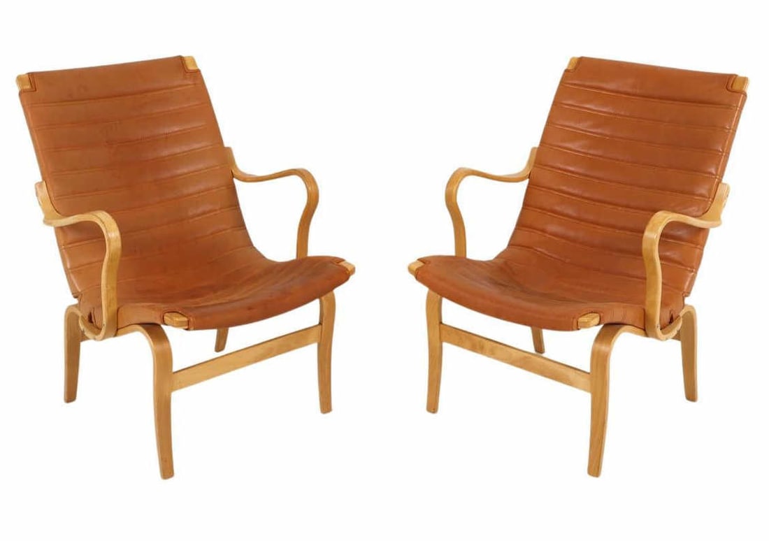 PAIR OF BRUNO MATHSSON FOR DUX CHAIRS: This is an iconic pair of lounge chairs known as the 'Eva' model, designed by Bruno Mathsson for DUX. Crafted from beechwood using the bentwood technique, the 'Eva' chairs have an elegant curving form